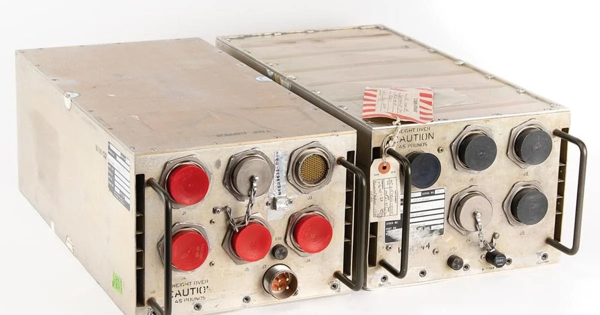 Examining circuit boards from the Space Shuttle's I/O Processor