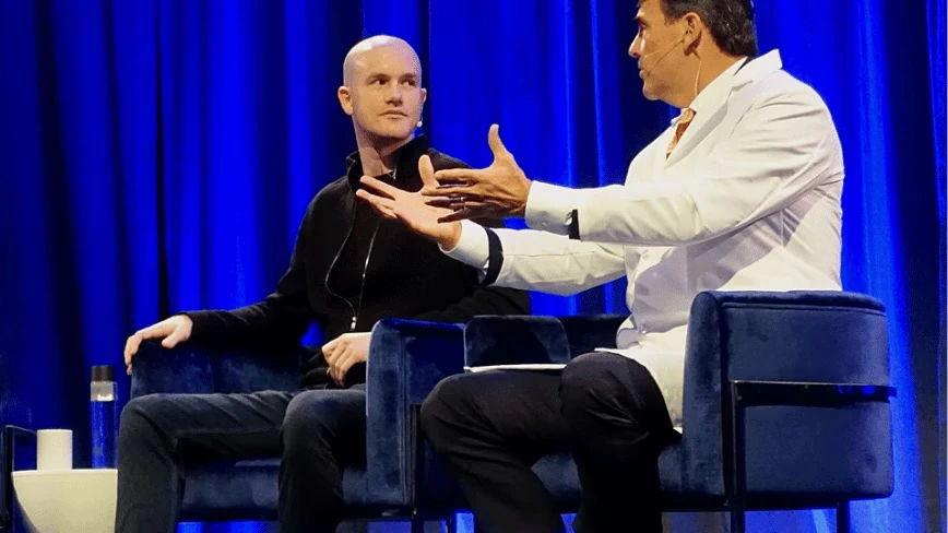 Coinbase is cutting 14 per cent of its workforce. The reason it gave was not the crypto downturn. It was AI.