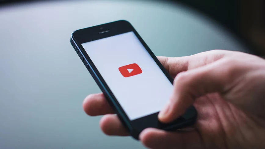 YouTube will now automatically label AI-generated videos, whether creators disclose them or not