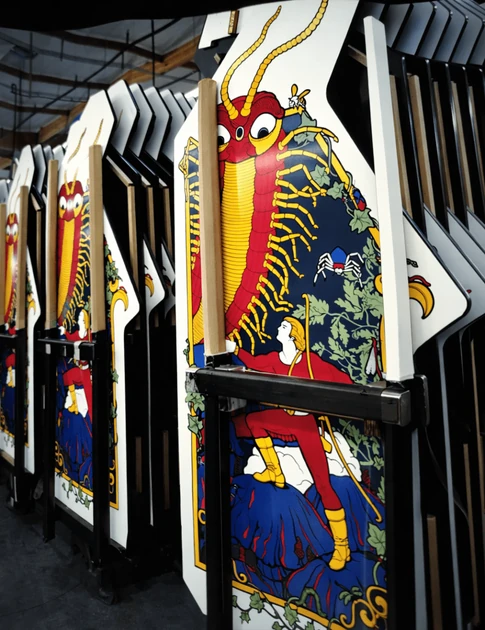 How did Atari apply side art to Arcade Cabinets?