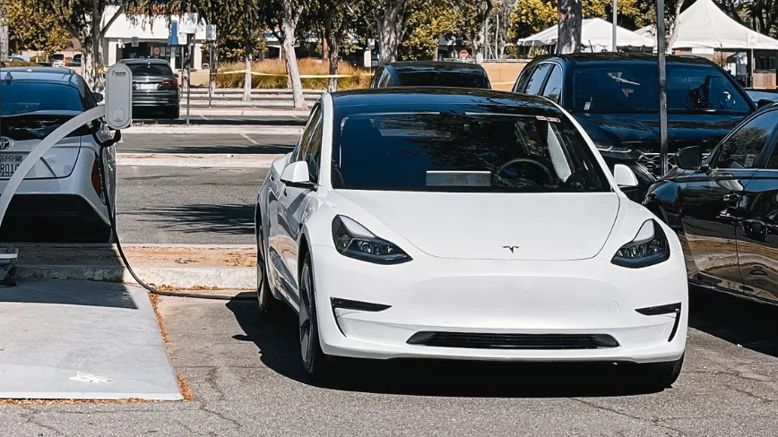 Tesla sold 25% more cars and made 57% less operating profit. The AI spending is the reason.
